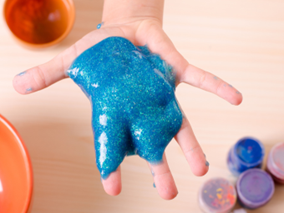 blue slime in childs hands